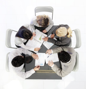 High angle view of business people working on the meeting.