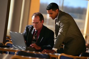 Businessmen and Laptop Computer